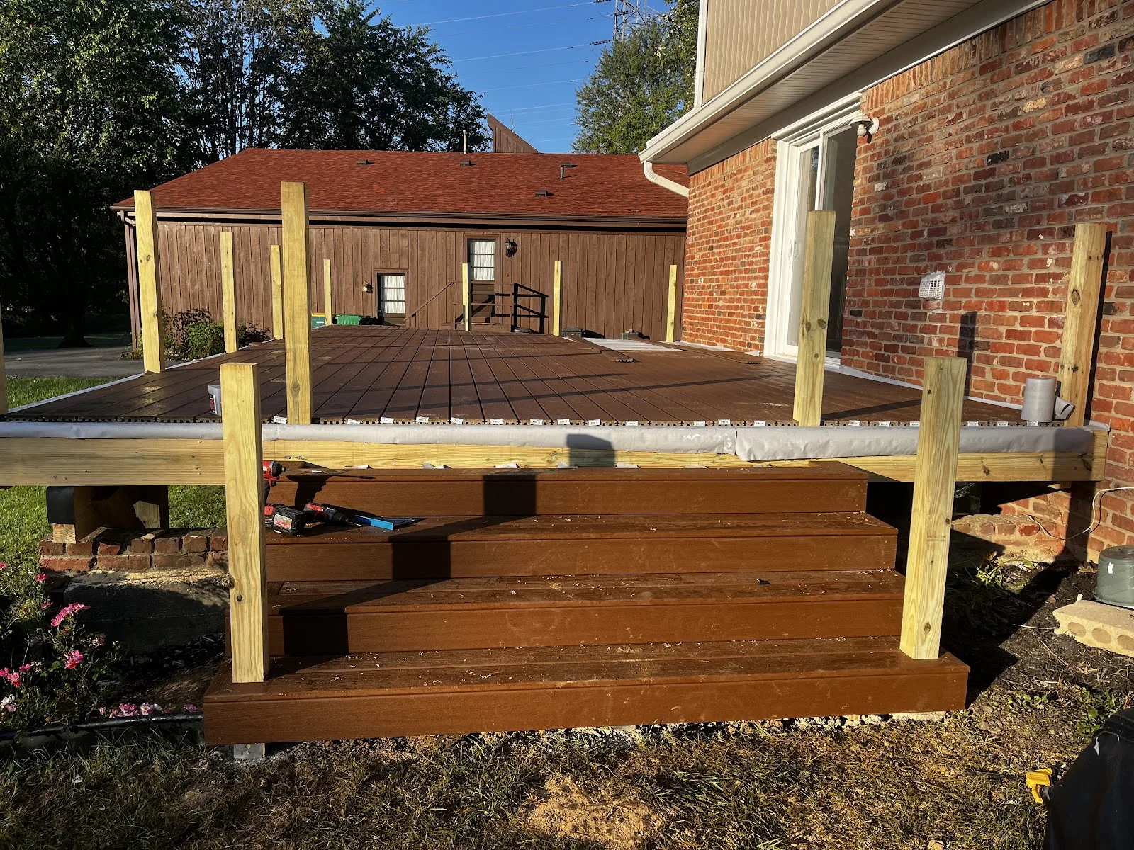 Composite deck installation with stairs by deck builder in Prospect KY