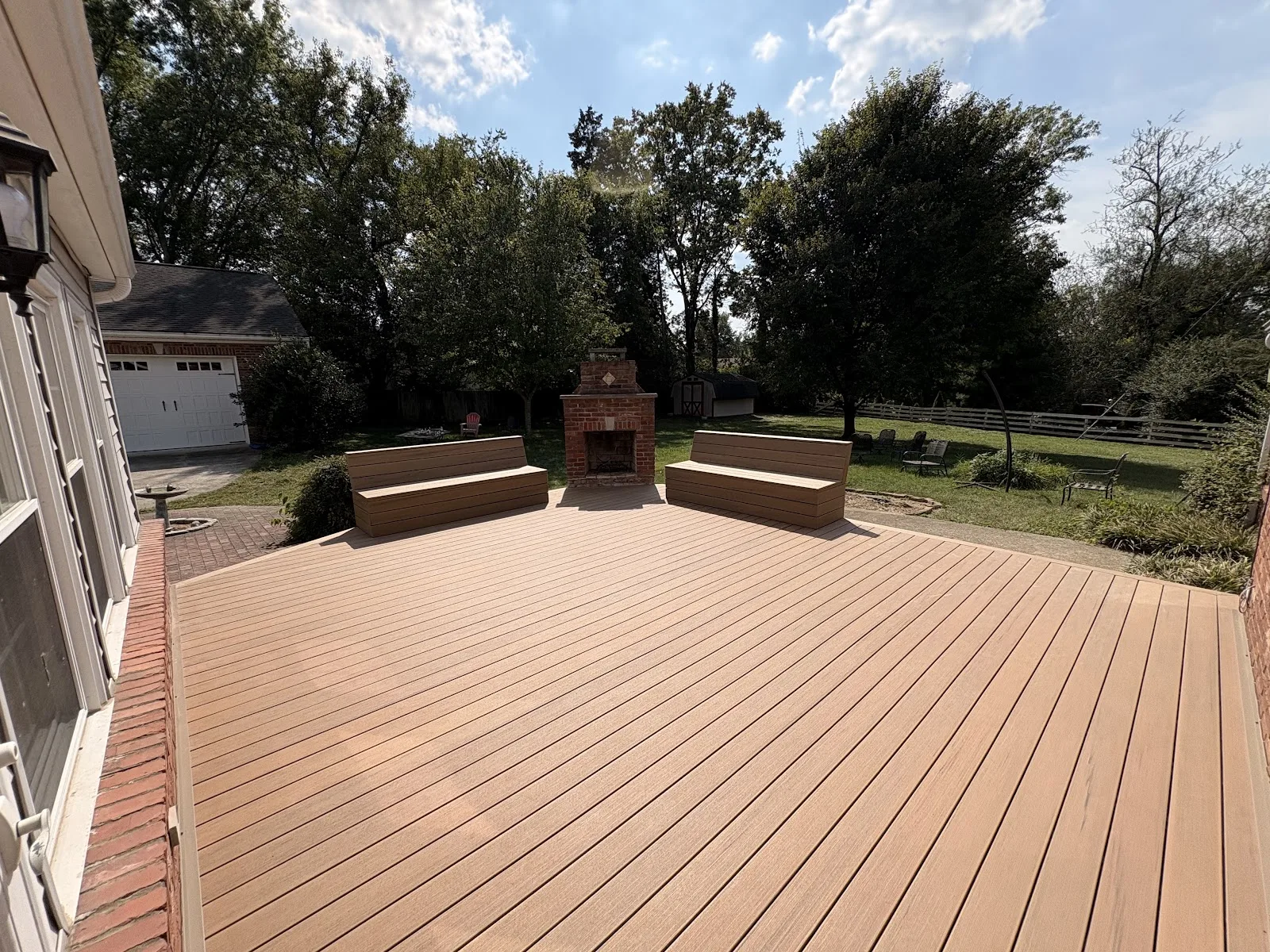 Spacious composite deck with benches in Crestwood